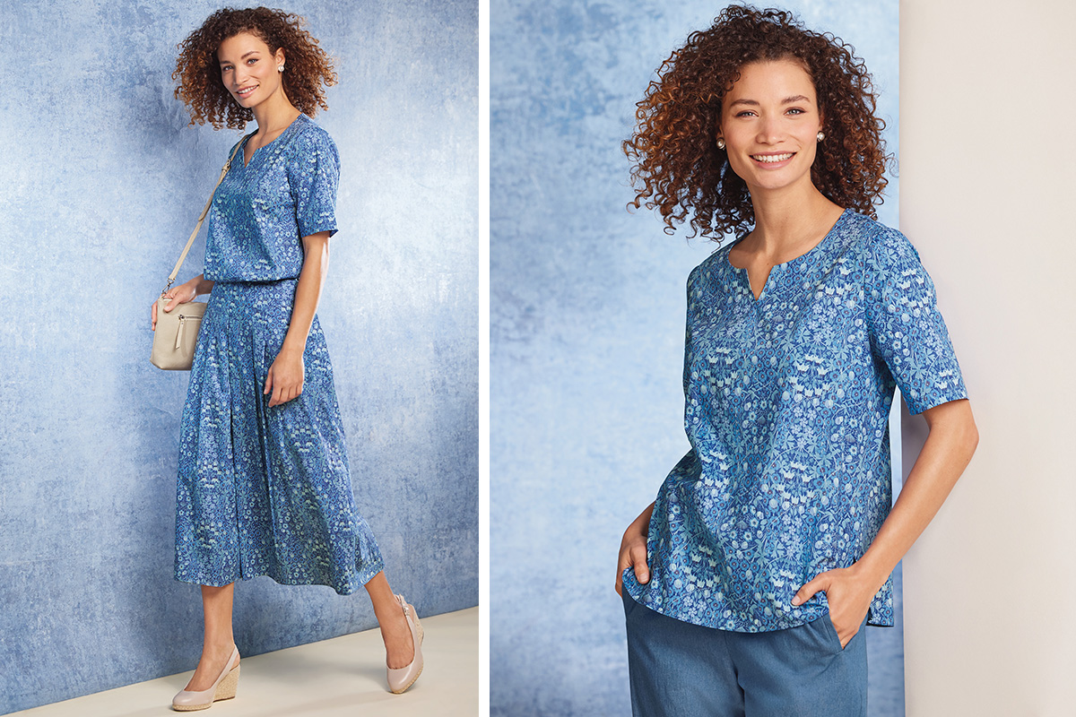 a blue intricately printed notch neck tunic and a matching pleated skirt.