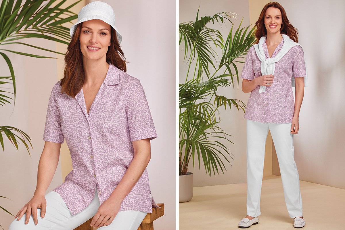 a lavender toned short-sleeve blouse with a intricate white floral print. 